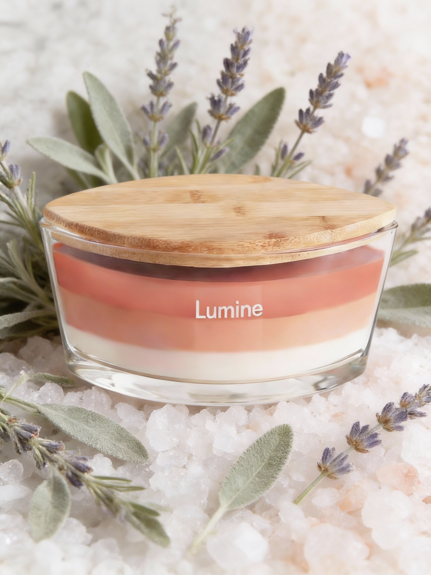 Lumine Sea Salt & Sage soy wax candle in a glass jar styled with sea salt crystals and sage leaves.